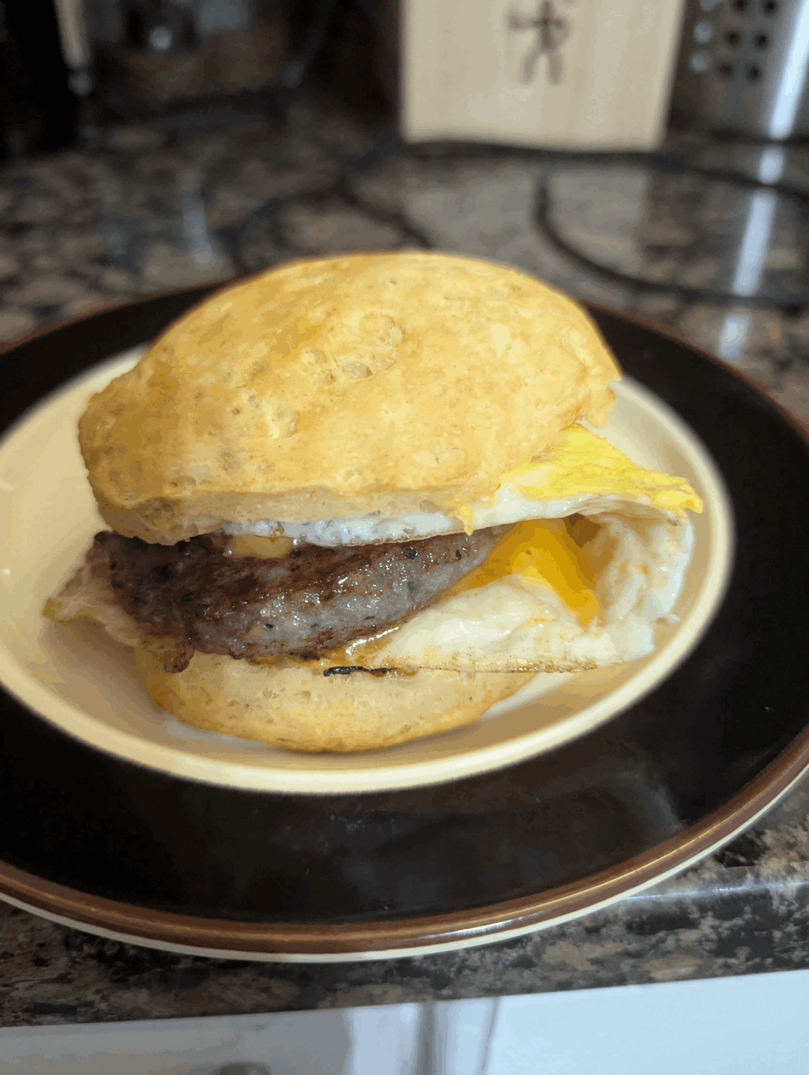 A biscuit sausage egg and cheese