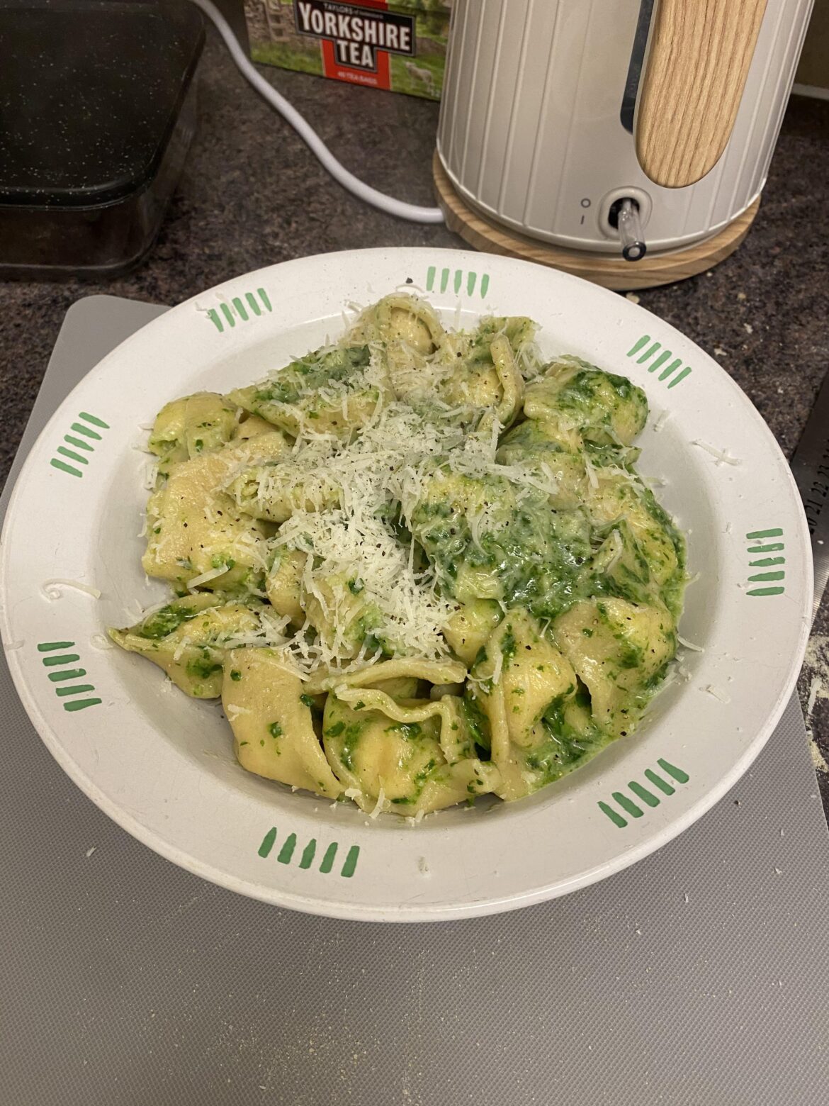 Homemade spinach and ricotta tortellini with basil pesto