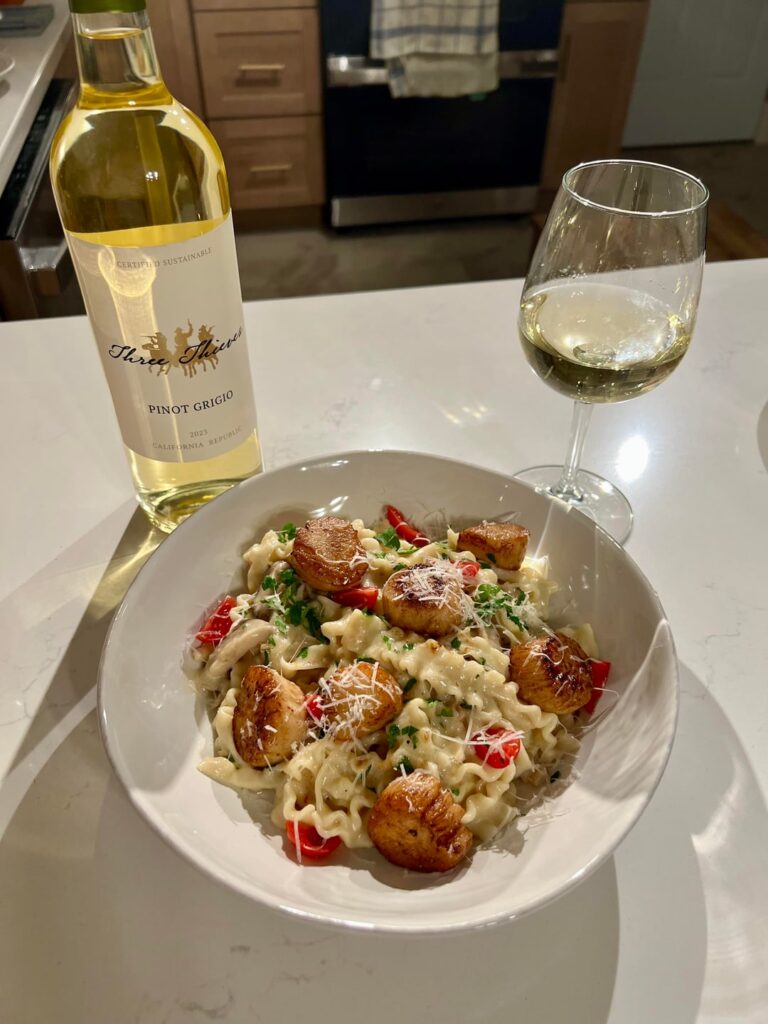 Pan-seared scallops over a white wine mushroom/shallot cream sauce