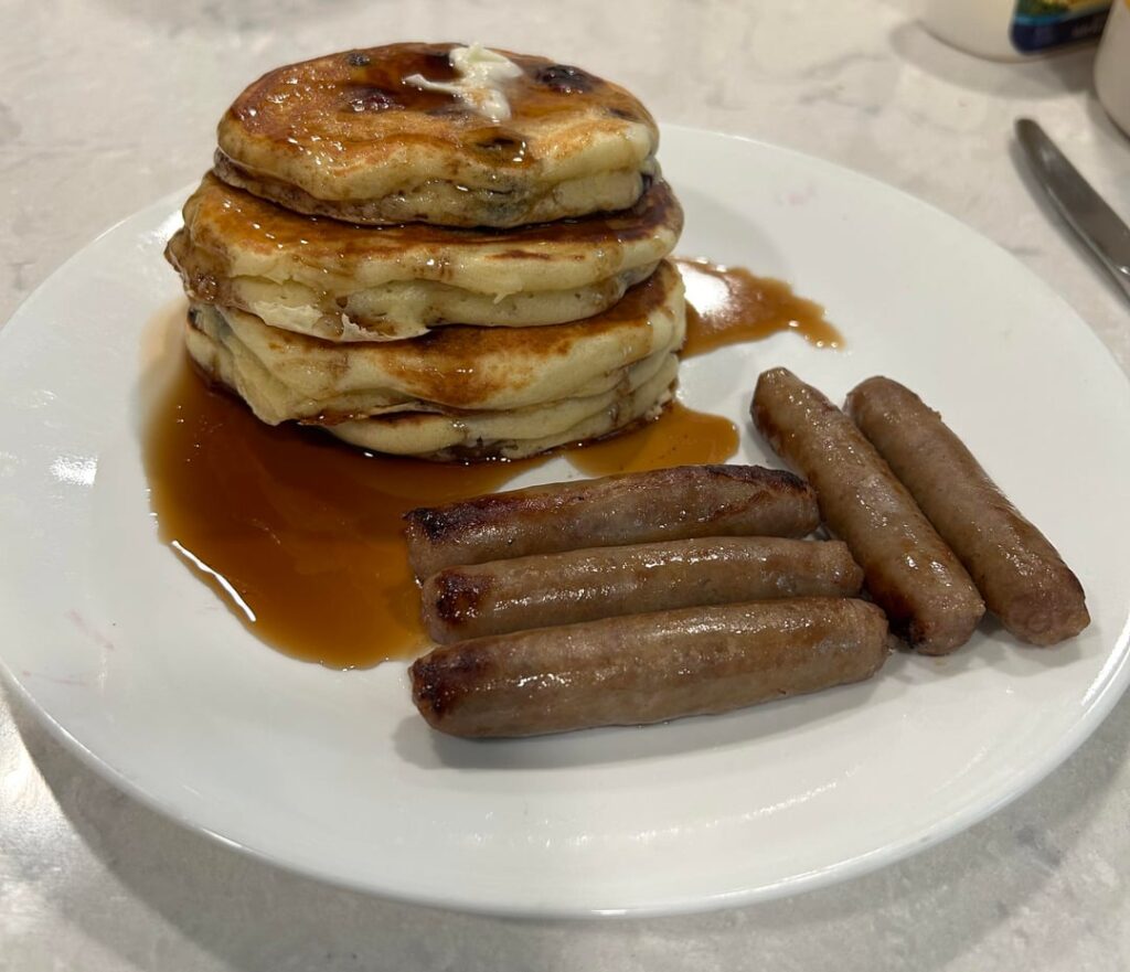 Blueberry buttermilk pancakes with real maple syrup and sausage links