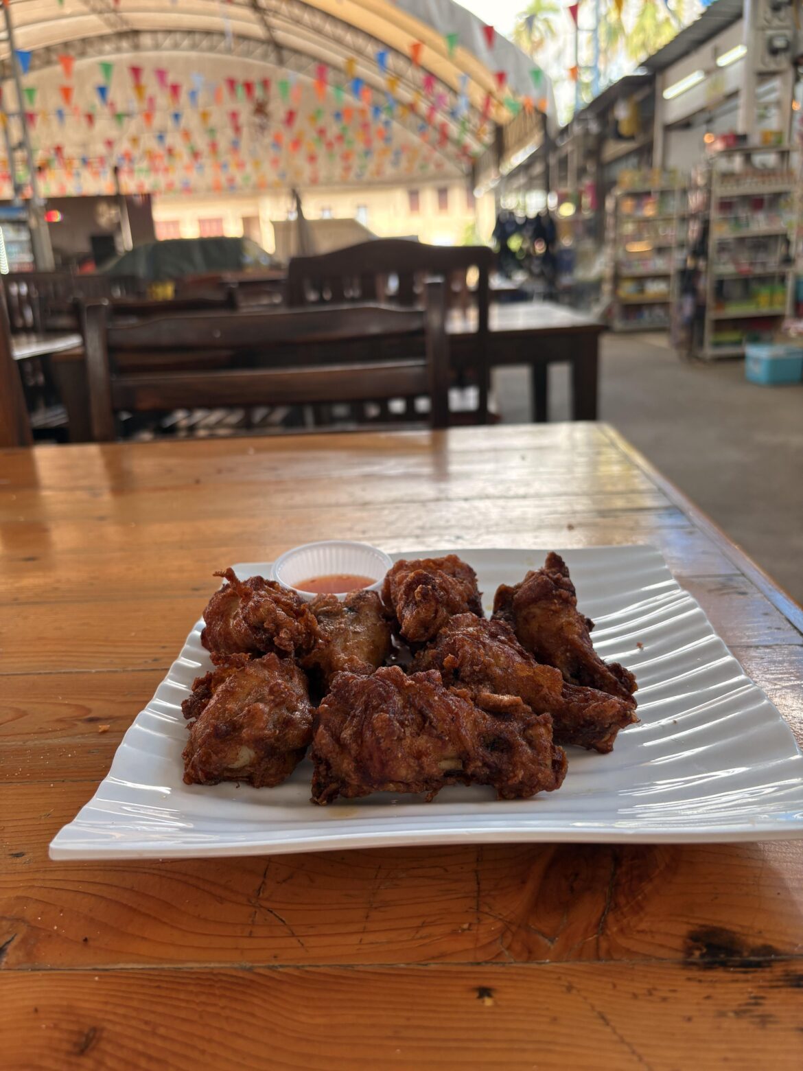 7pc for 100 baht ($3US and change).  A bit overcooked but way underpriced. Thai sauce made them pretty dang good.