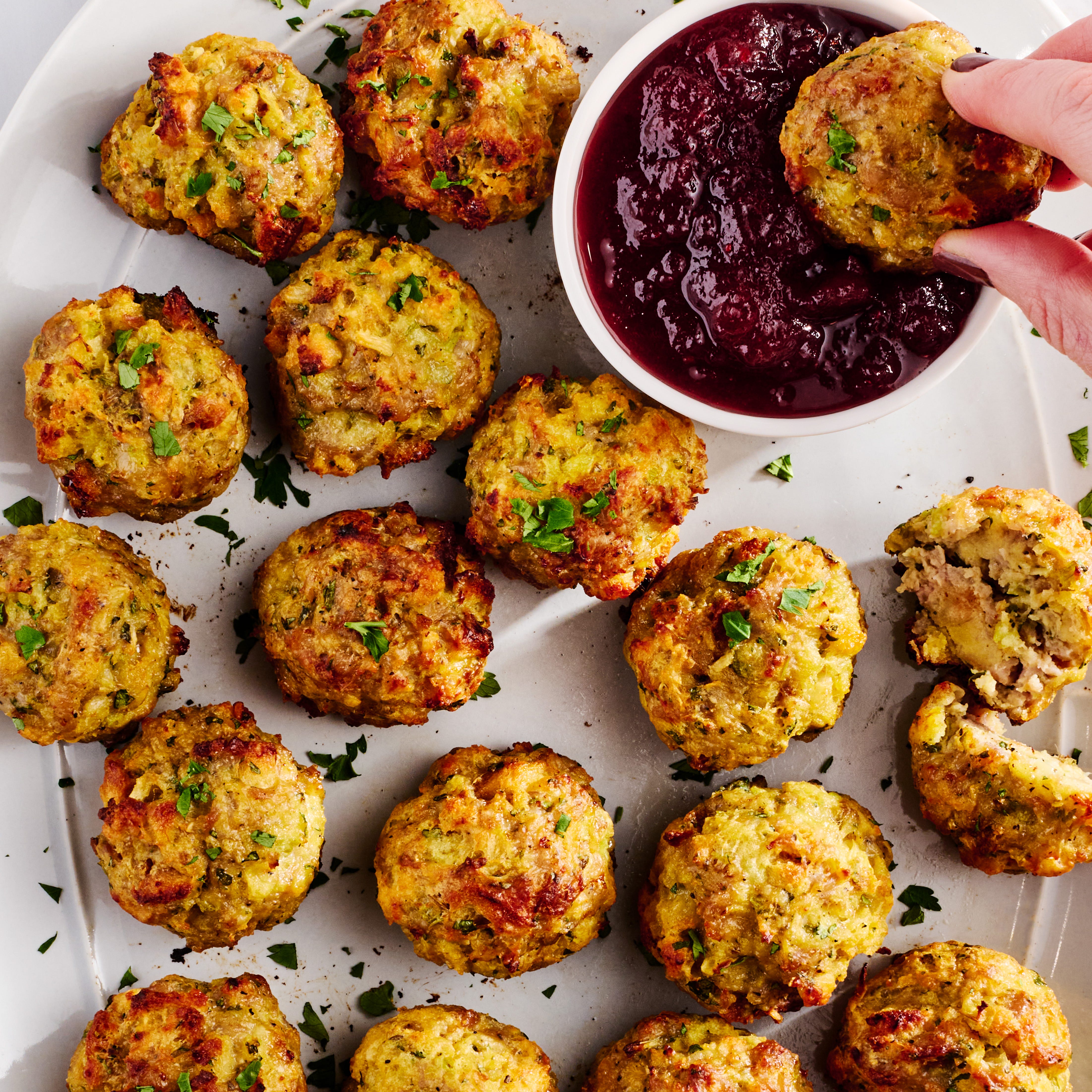 sausage stuffing bites with cranberry sauce