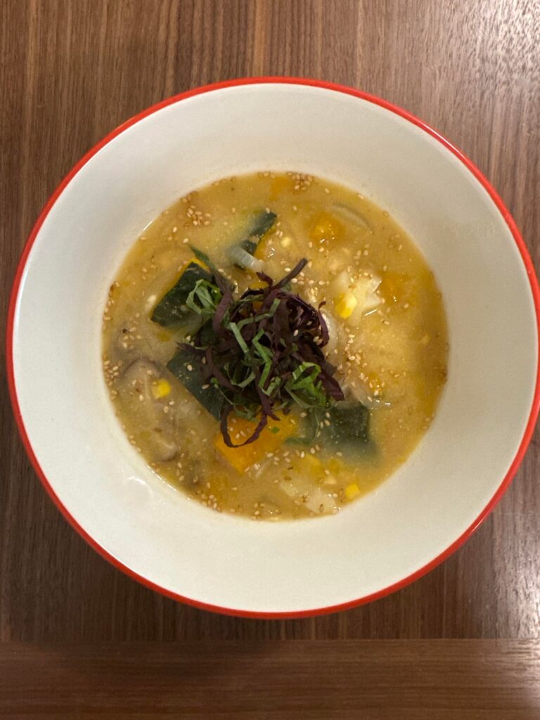 Kabocha and corn miso soup with crispy glazed sweet potatoes and sesame broccoli