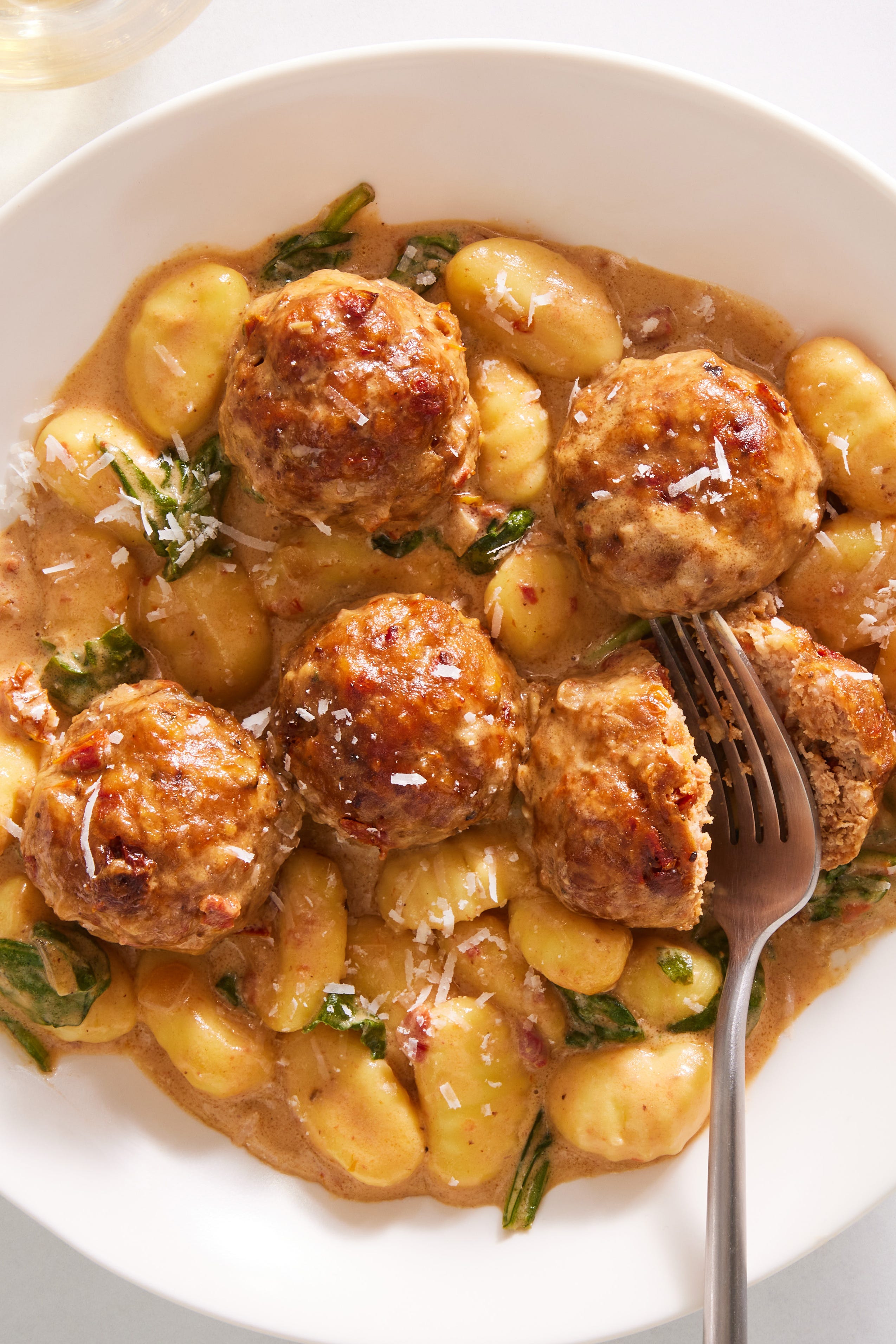 chicken meatballs and gnocchi in a creamy tuscan sauce