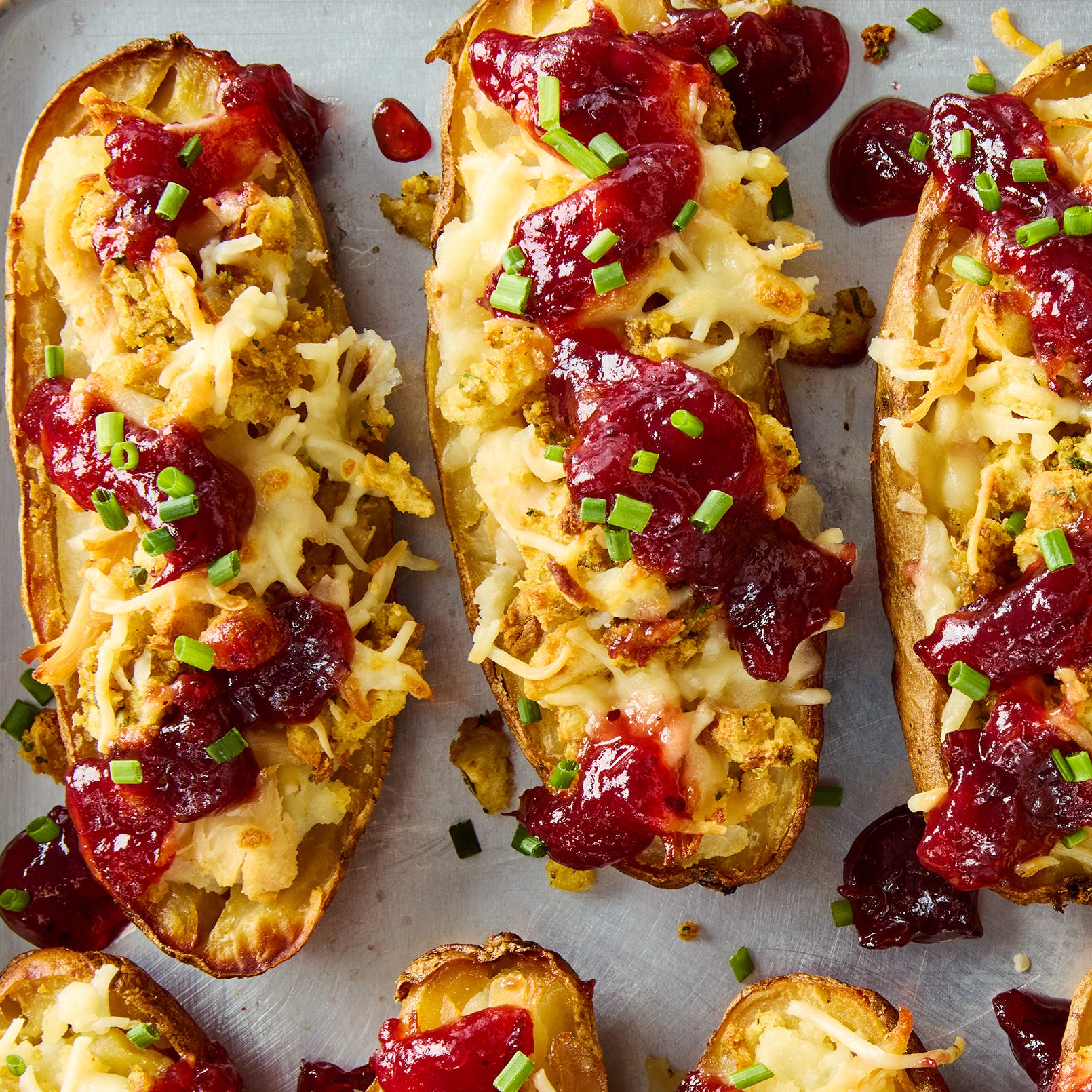 potato skins stuffed with mashed potatoes, stuffing, turkey, and topped with cranberry sauce