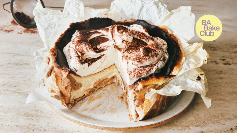A basque cheesecake topped with whipped mascarpone and dusted with espresso powder.