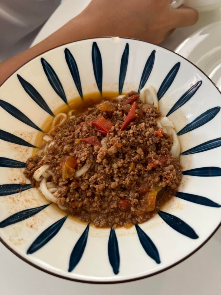 how many calories for this bowl of noodles and bok choy and tofu skin baozi?