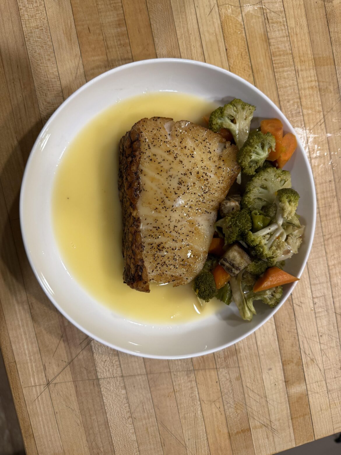 Chilean Sea Bass with beurre blanc and veggies