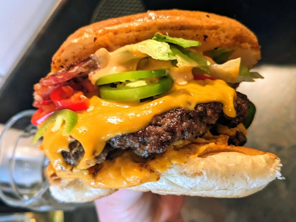 Five Guys costs £34 ($46) for 2 standard burgers a small fries and a milkshake. Mine costs £1.50 ($2). Five Guys costs £34 ($46) for 2 standard burgers a small fries and a milkshake. Mine costs £1.50 ($2).