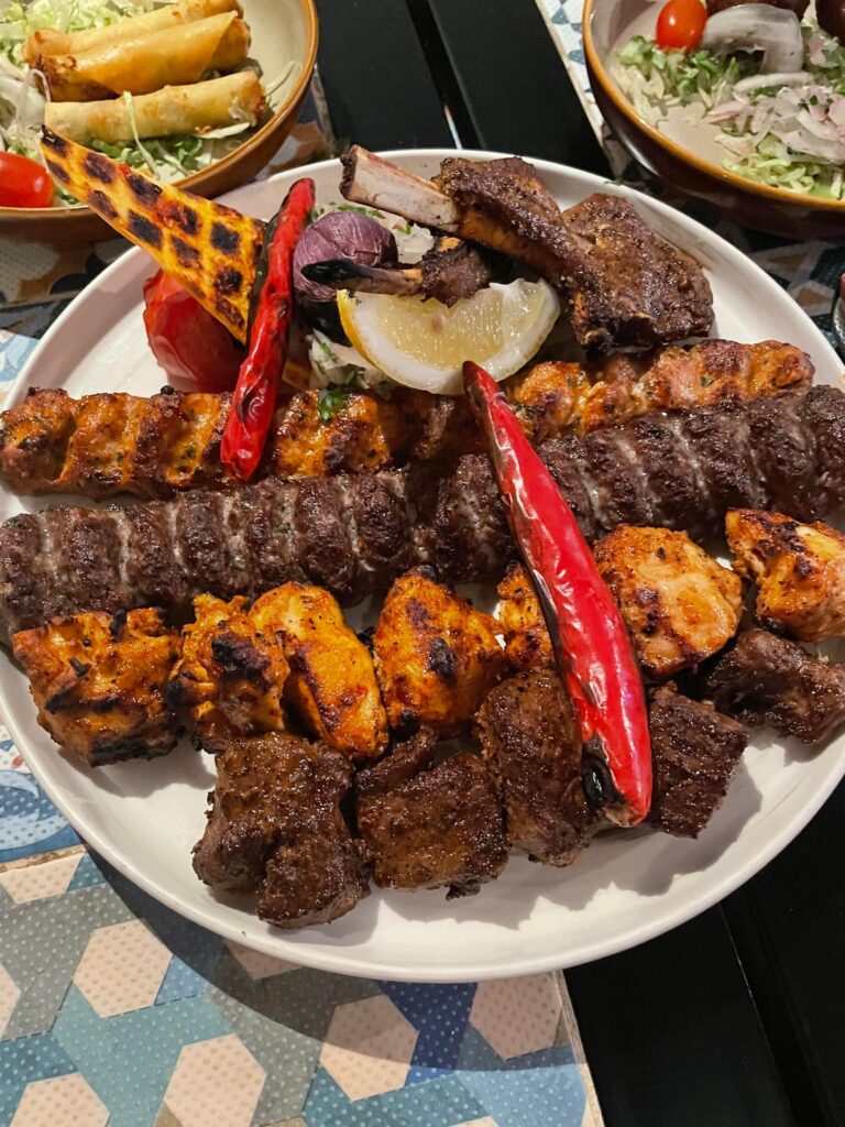 [I ate] Lebanese kabobs, lamb and couscous stew, fried cauliflower, kibbeh, cheese cigars and dips.