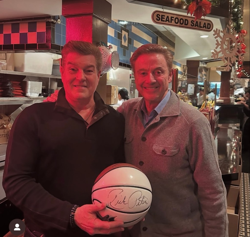 Vincent's Clam Bar owner Bobby Marisi with Rick Pitino and a signed basketball.