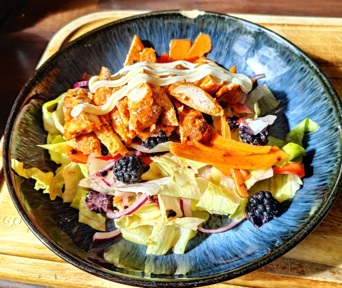 Like and chili chicken salad with blackberries in a lemon and elderflower dressing