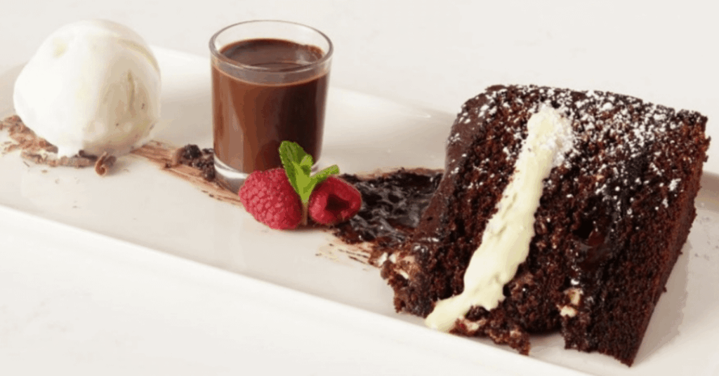 Chocolate fudge cake with chocolate sauce and vanilla ice cream