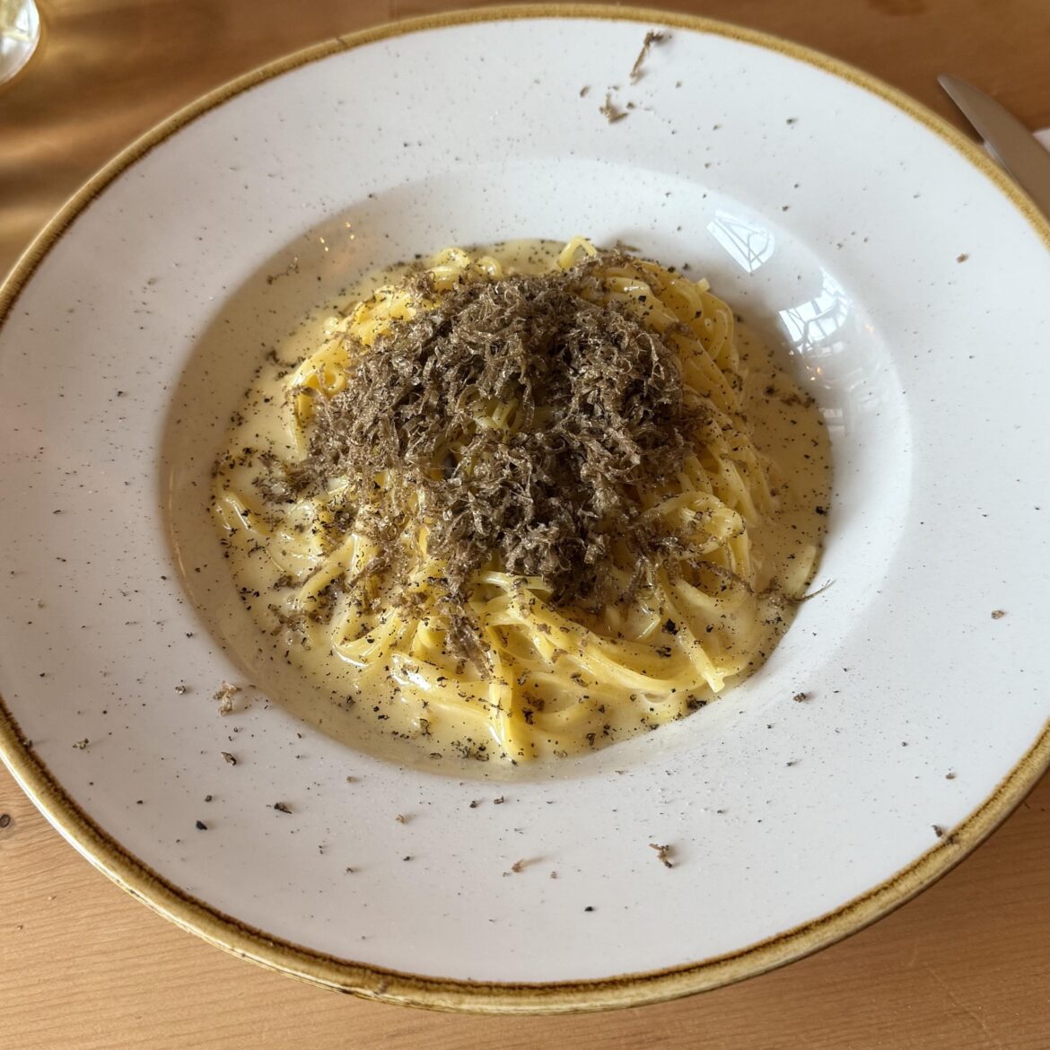 Tagliolini with parmesan cream and fresh black truffle Tagliolini with parmesan cream and fresh black truffle