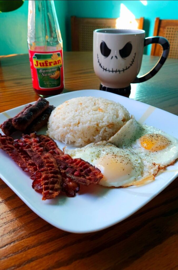 Monday morning bacon, sausage, eggs, and garlic rice to set the tone.