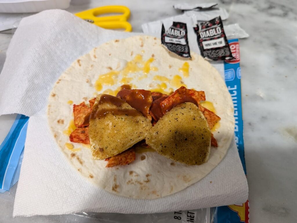 Cheddar cheese, Flamin Hot Cool Ranch Doritos, nacho cheese toasted ravioli and diablo sauce burrito