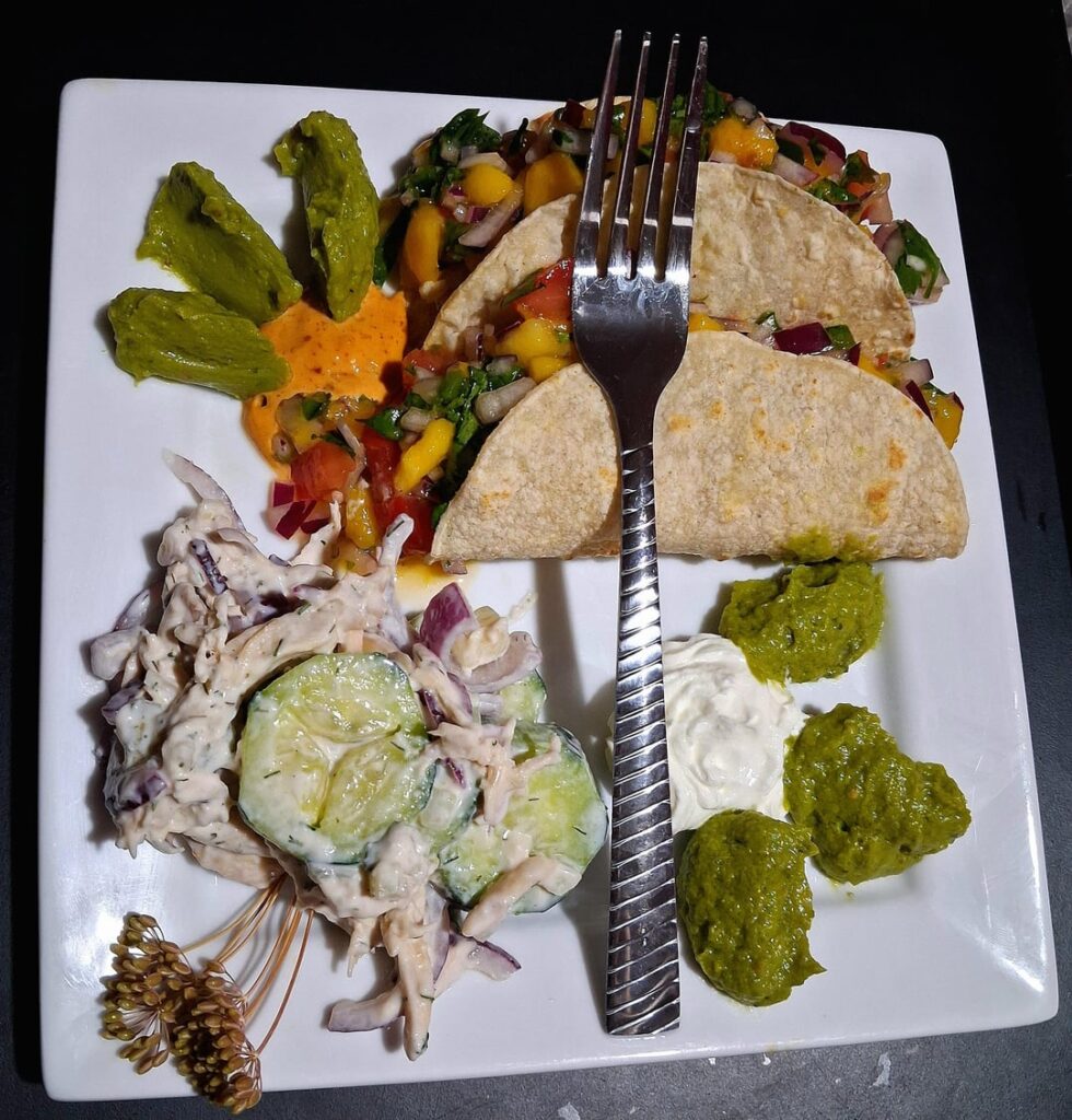 Tilapia Fish Tacos with Mango Salsa and a Cucumber Salad.