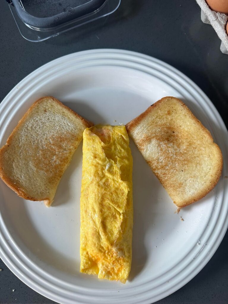 Rolled omelete with toast 🧀 🍅 🧅 🧂  swipe for dirty pic