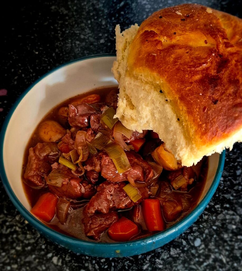 Minted mutton stew with homemade 'dinner roll'