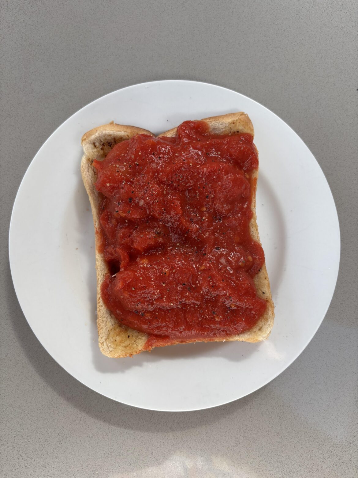 Sometimes, simple is best. Slow-stewed tinned tomatoes on buttered toast with lots of salt & pepper for breakfast