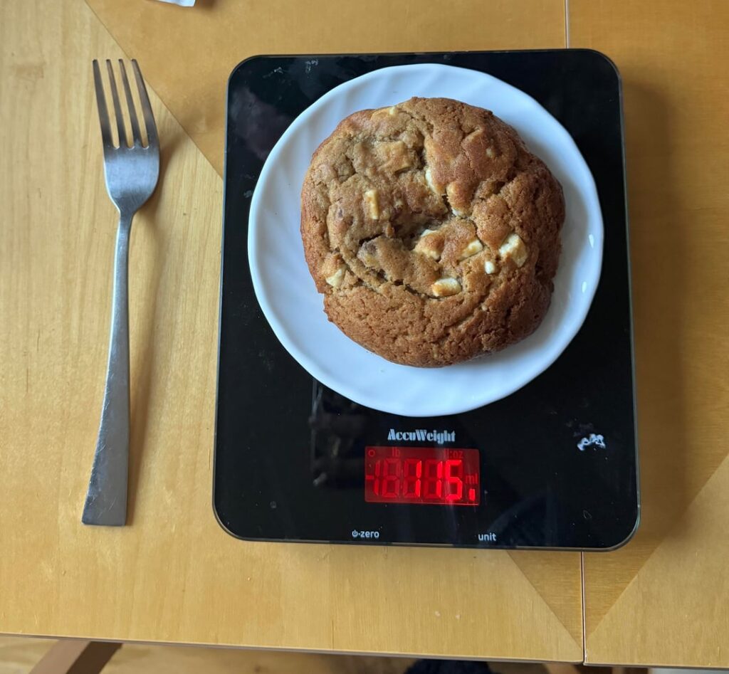 Calories in this chunky cookie - white chocolate, miso, and pecan. It weighs 115g :))