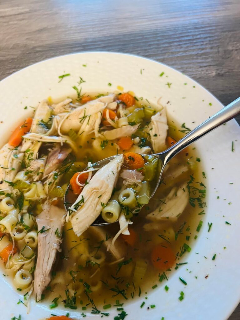 [homemade] perfect, crystal clear, rich whole bird chicken noodle soup.
