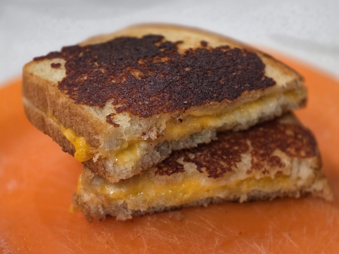 Parmasean-butter crusted sourdough grilled cheese with sharp cheddar and mozzarella