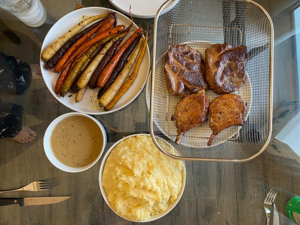 Pork chops & Coppa Steaks w/ Caper sauce, carrots, & mash potatoes