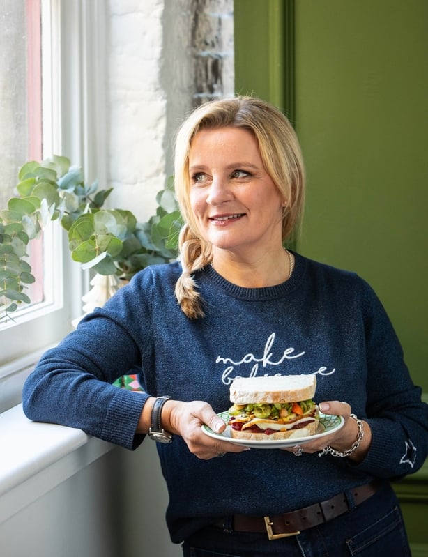 A photo of Suzanne Mulholland with a Christmas sandwich