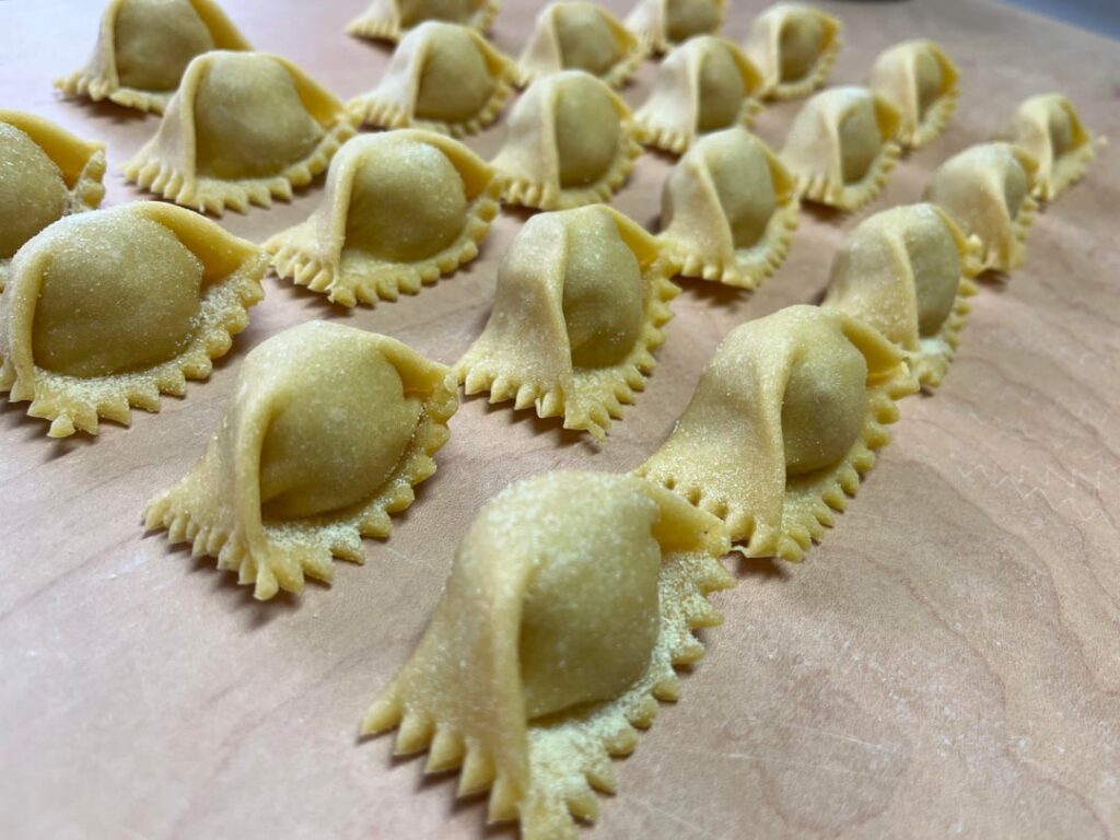 Agnolotti del Plin with a butter sauce and basil
