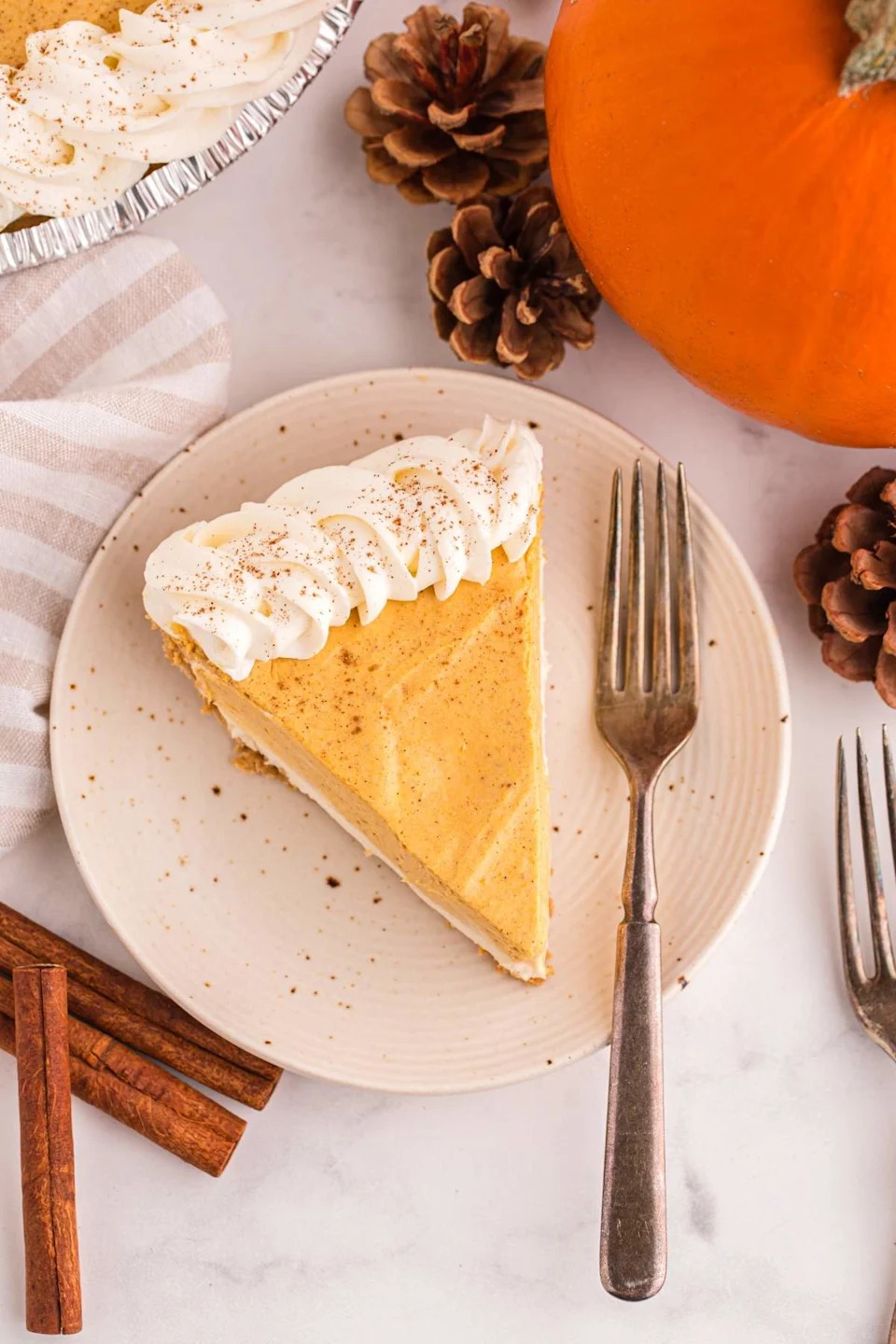 No bake pumpkin pie cheesecake on a plate.