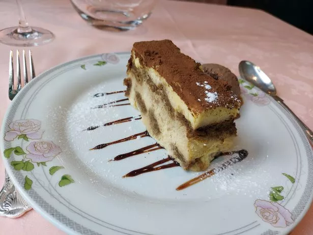 Tiramisu served with a scoop of ice cream is the perfect refresher after a heavy main course