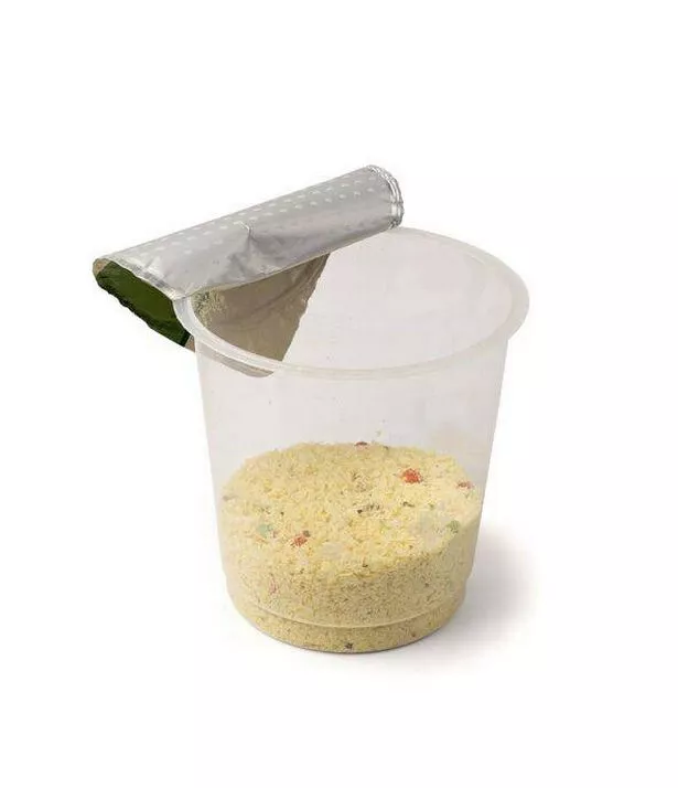 Instant Mashed Potato Powder Isolated, Potato Puree Flakes in a Plastic Cup, White Vegetable Flour