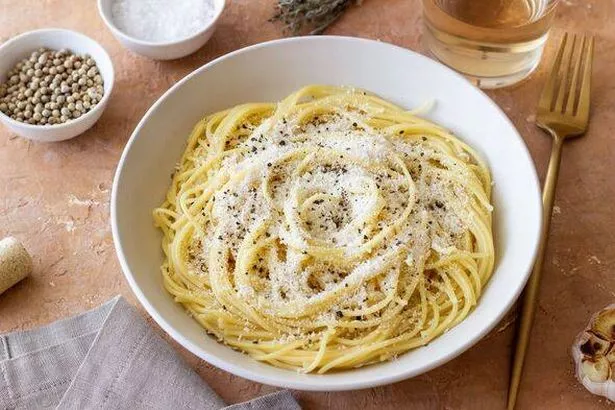 Roman pasta spaghetti with black pepper and cheese. Cacio e pepe. Recipes.