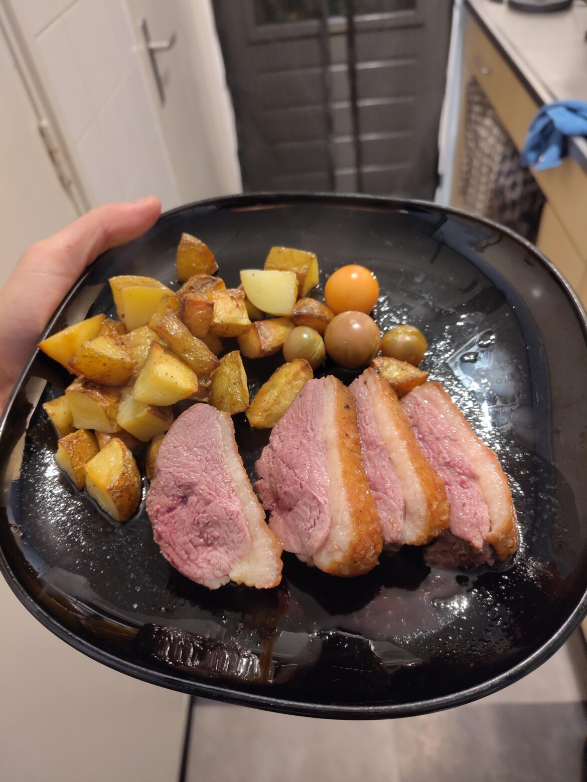 Duck breast with potatoes and homegrown tomatoes