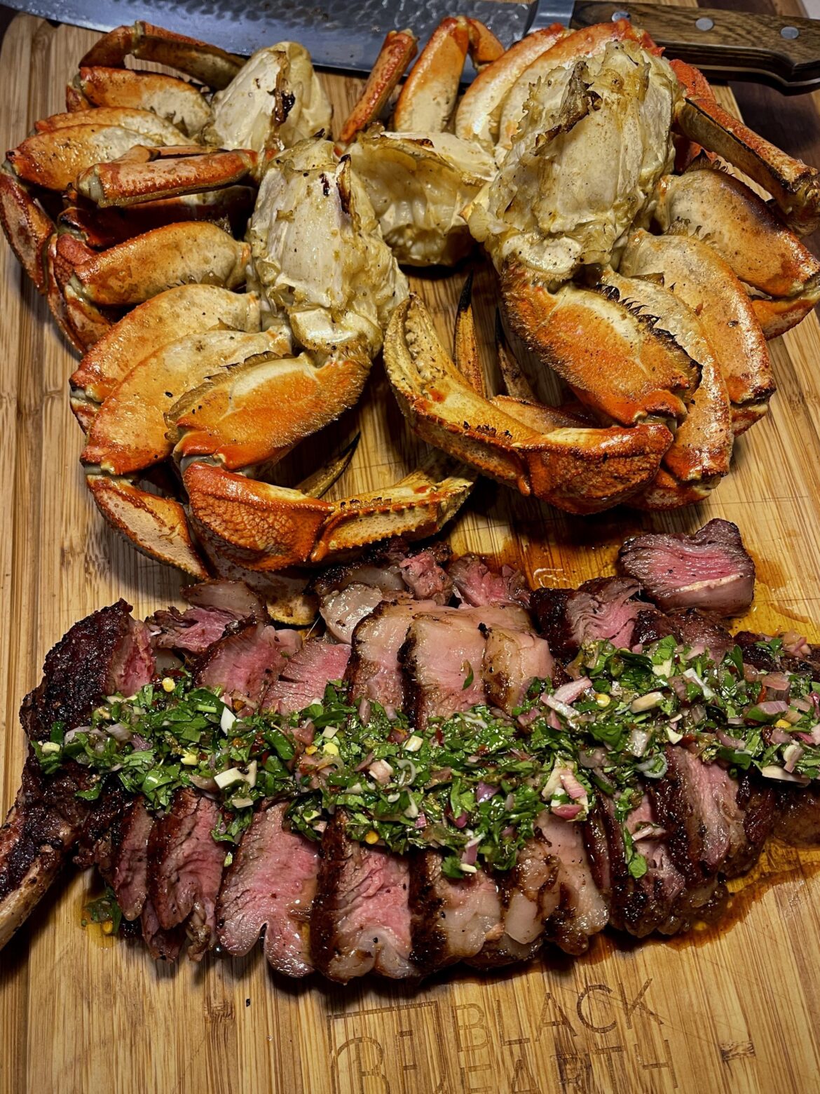 [OC] Reverse Seared Cowboy Ribeye w/ Chimichurri and Grilled Dungenous
