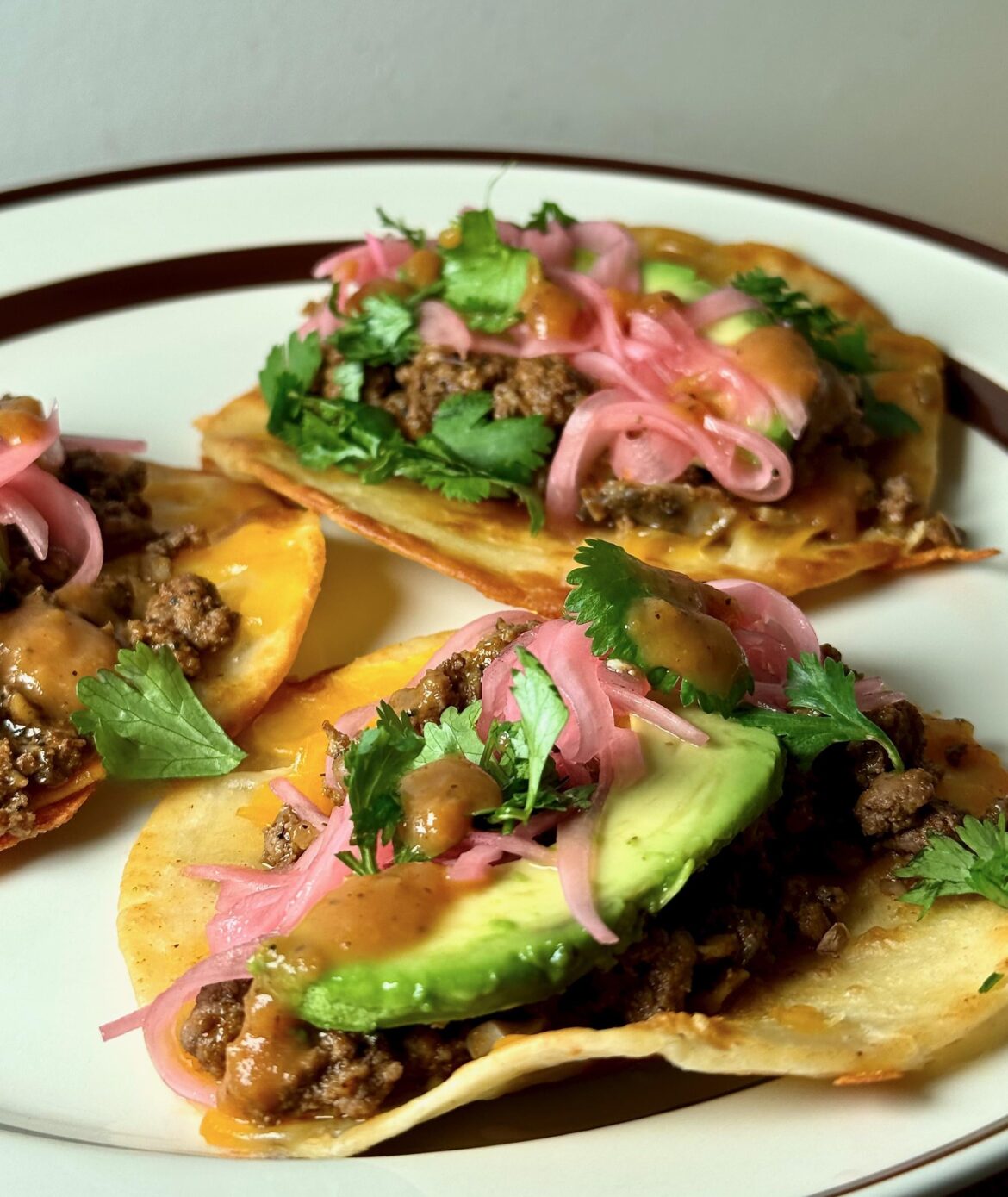 [homemade] Tacos, fried flour torts, Kerrygold aged cheddar, gringo ground, avo, pickled red onions, Secret Aardvark.