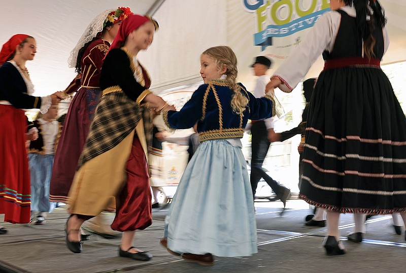 Mary Landfair (center), age 4, performs a traditional dance with her troupe from the Annunciation Greek Orthodox Church in Little Rock during the Greek Food Festival on Saturday, Oct. 4, 2025. (Arkansas Democrat-Gazette/Colin Murphey)
