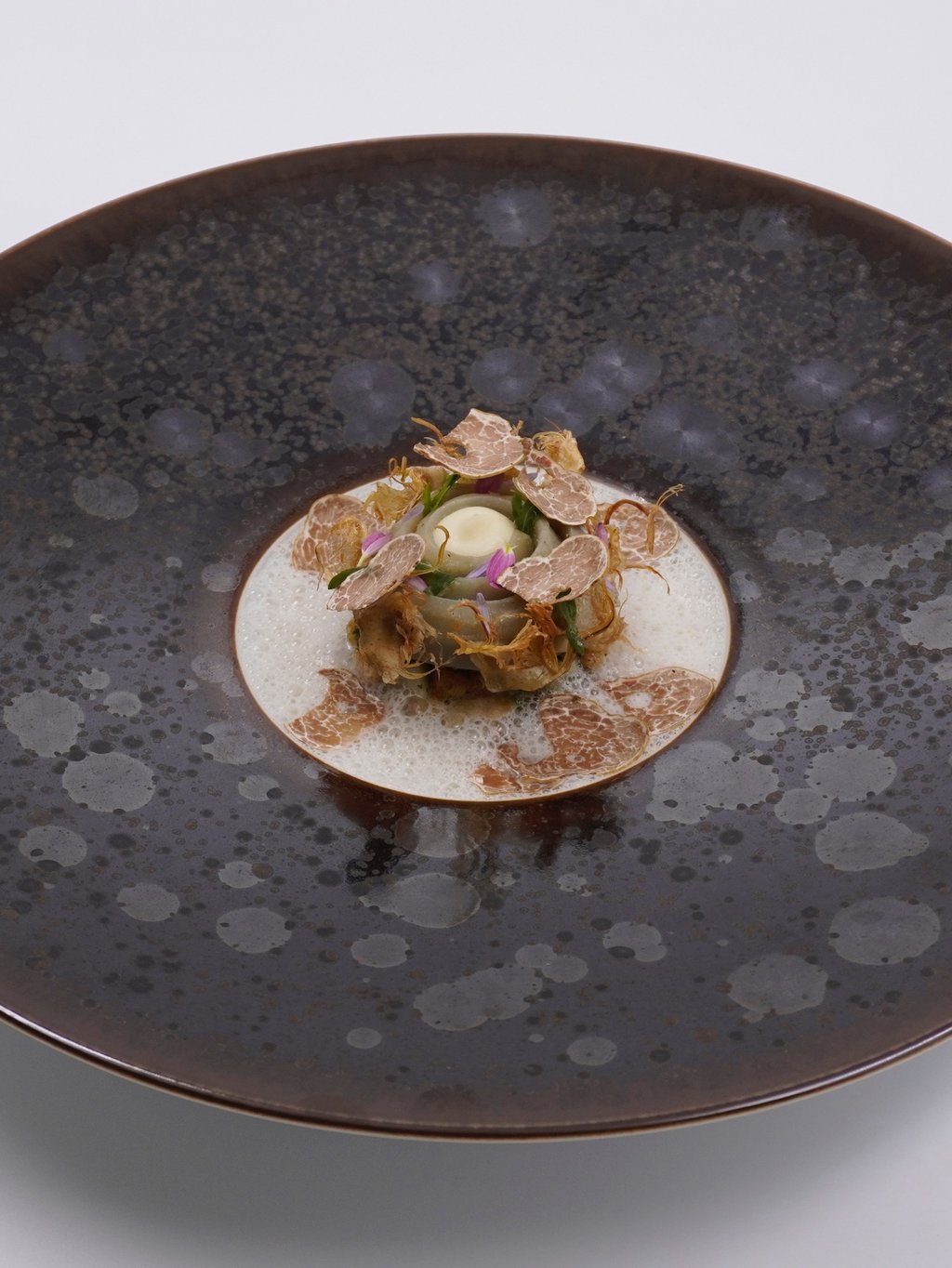 Chef’s Table Bangkok’s artichoke à la barigoule with comte cheese and the all-important Alba white truffle. Photo: Handout