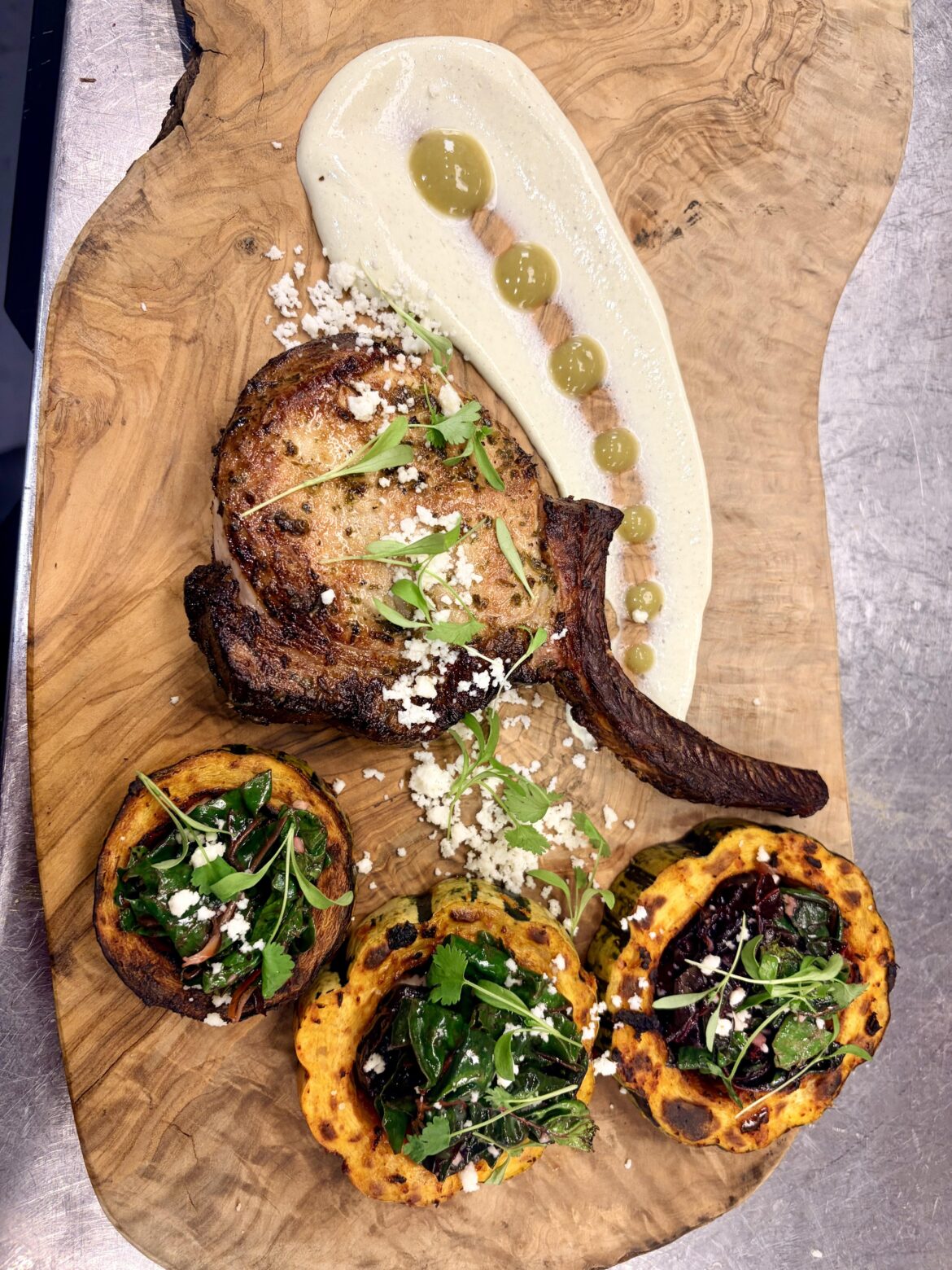 Chimichurri Marinated Smoked Pork Chop|Harissa Roasted Delicata Squash|Sauteed Chard|Poblano Crema’|Poblano Puree|Queso Fresco|Micro Cilantro