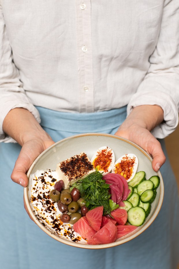 A dish including seasoned tofu, a soft-boiled egg in XO sauce, pickled onion, cucumbers, tomatoes and olives from Valley Bar + Bottle in Sonoma. (Eileen Roche / for Sonoma Magazine)