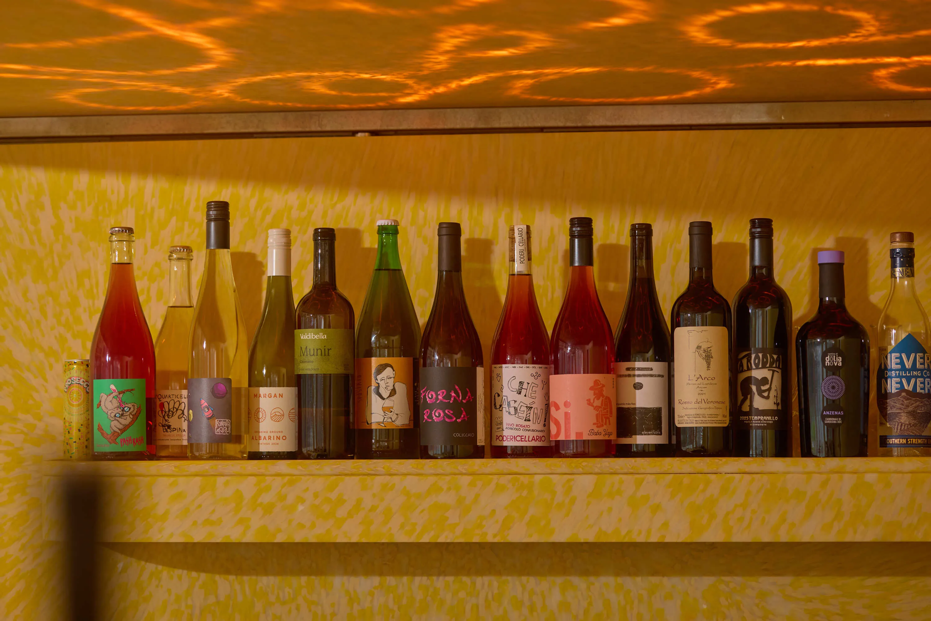 A line-up of bottles on a shelf at Melitta Next Door.