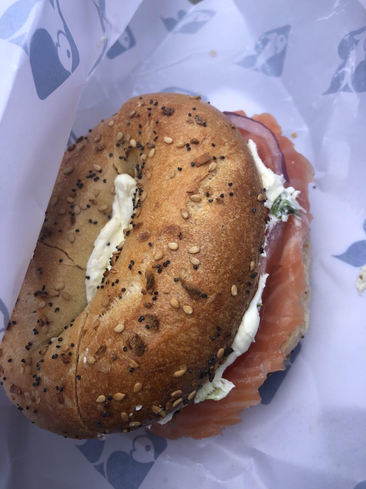 Takeaway bagel from Russ & Daughters in East Village, NYC. This was a toasted everything bagel w/ scallion cream cheese, smoked salmon, tomato, onion and capers.