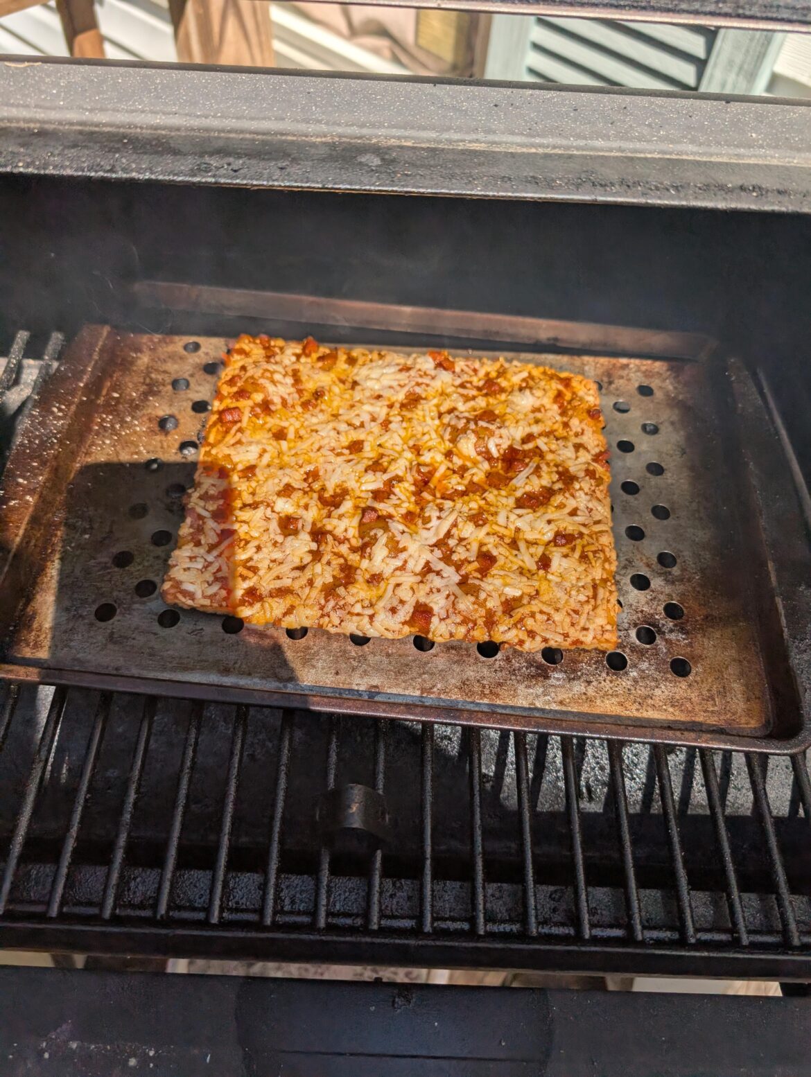 Would y'all disown me for doing a $2 totino's pizza on the smoker? It came out freaking amazing lol