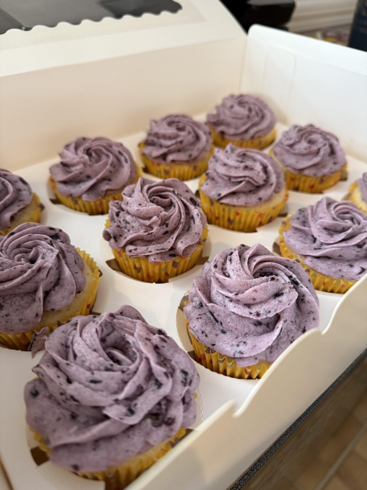 Lemon cupcakes with blueberry buttercream