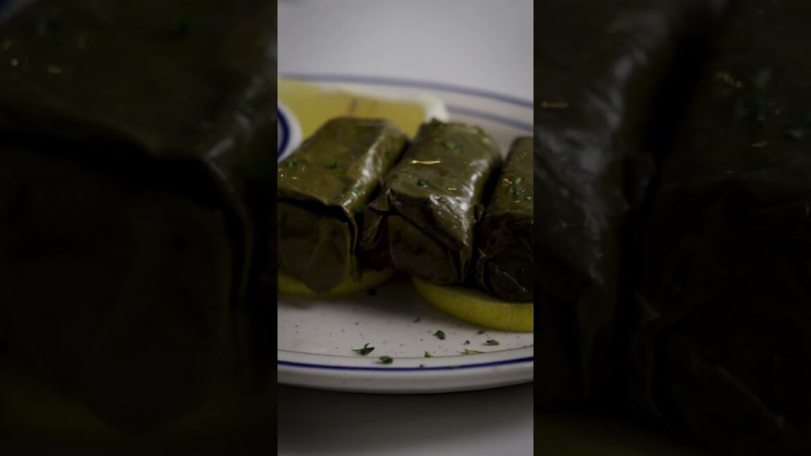 Dolmades - Grape leaves hand-rolled and stuffed with rice, parsley, dill, mint, and lemon juice.