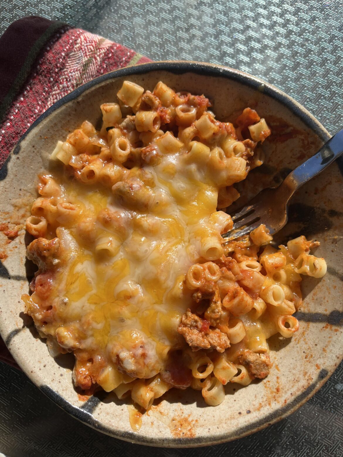 Perfect shitty lunch: boxed pasta, jar pasta sauce, and a whole lotta bagged shredded cheese