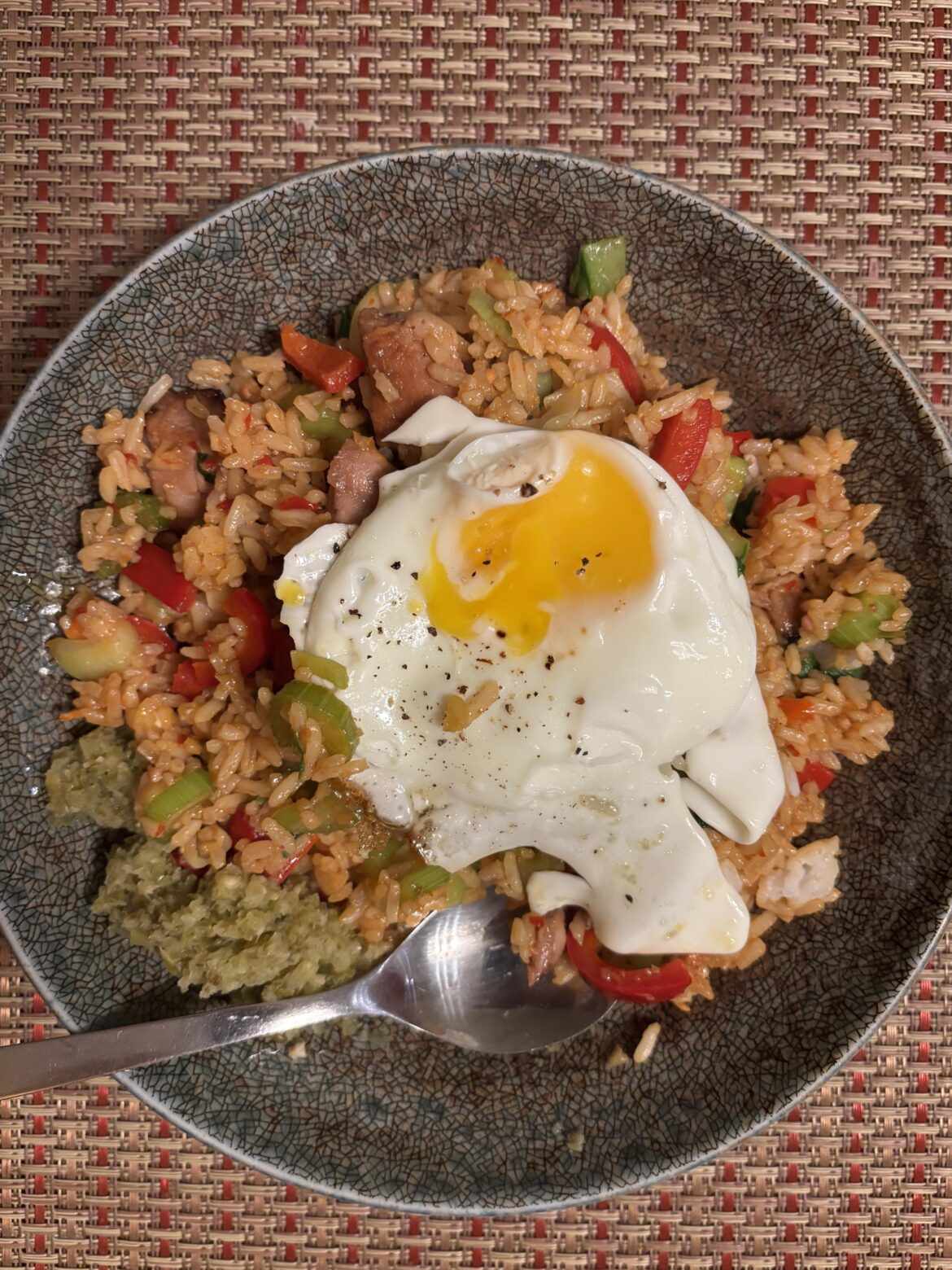 Pork and veg fried rice, green sambal with an egg on it
