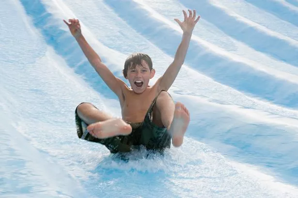Boy on waterslide