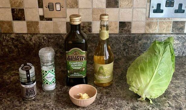 ingredients to cook cabbage - oil, vinegar, salt, pepper and cabbage